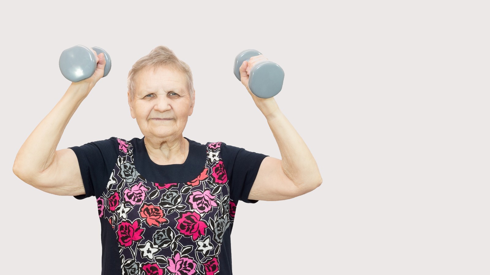 Older woman exercising with dumbbells