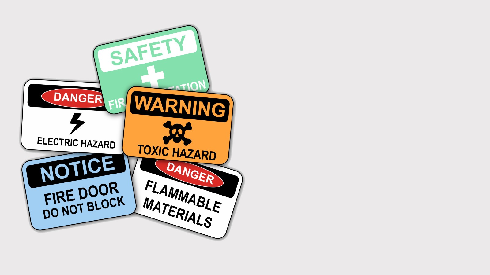 Various safety signs: Danger, First Aid, Fire Door, Toxic Hazard, Flammable Materials, Electrical Hazard