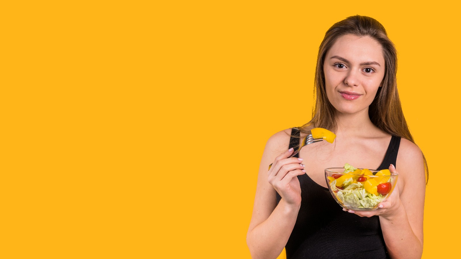 Woman eating fruit salad