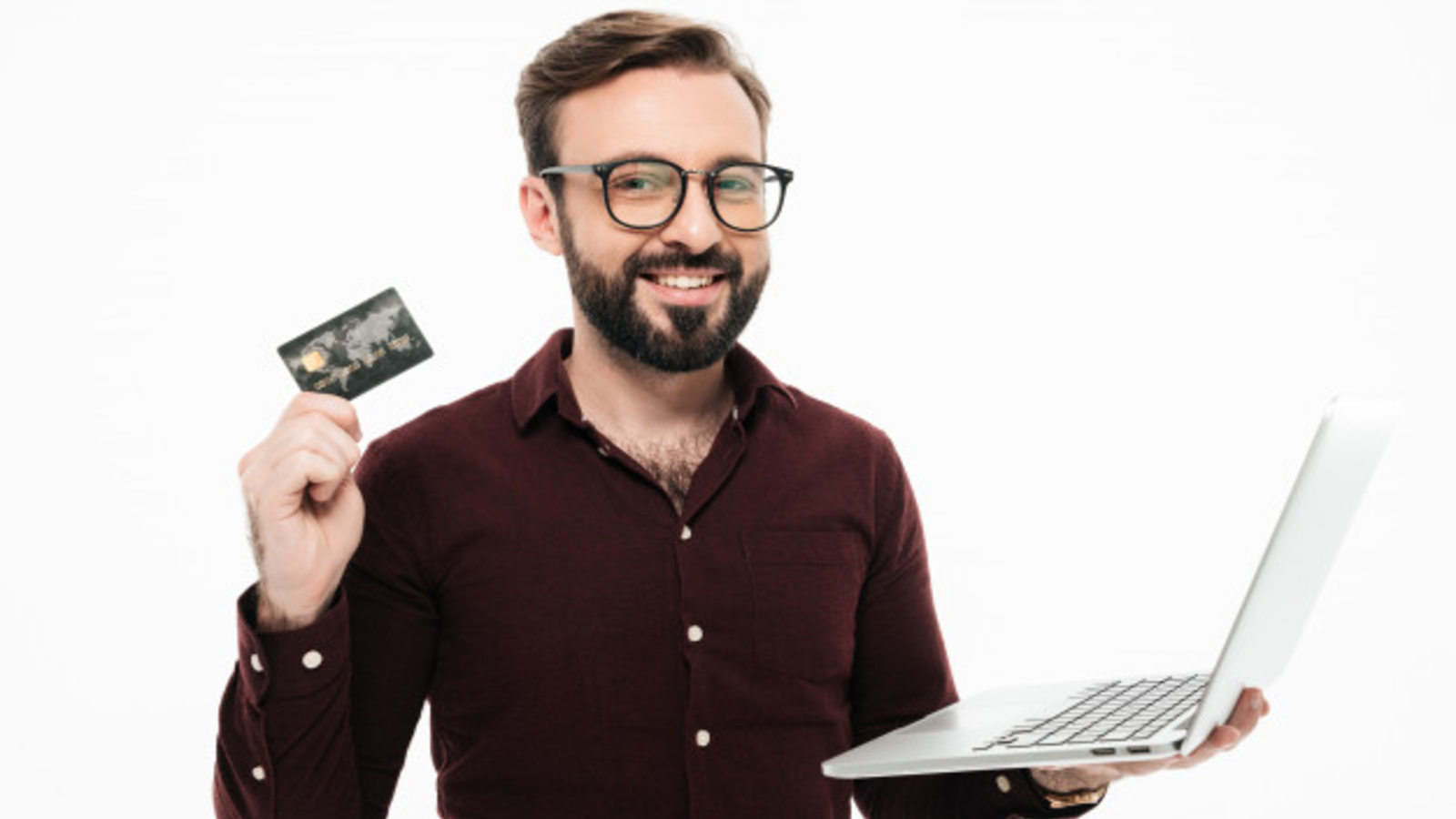 Man holding debit card and laptop