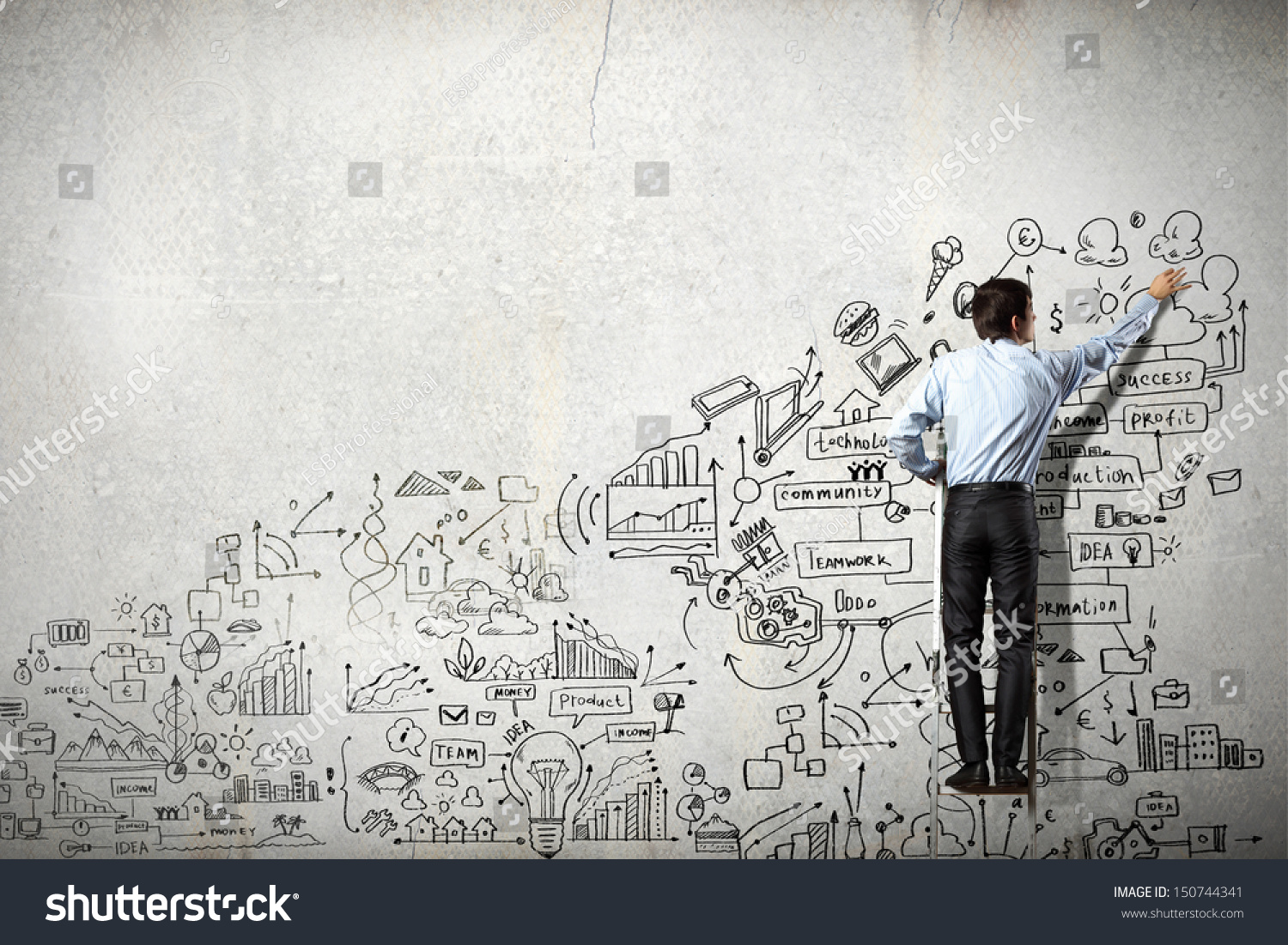 Back view of businessman drawing sketch on wall