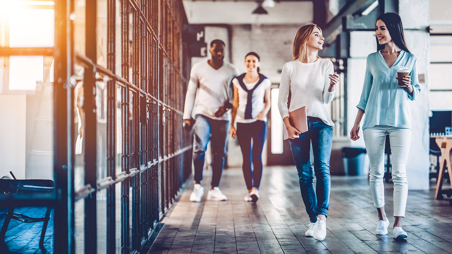 Work colleagues walking through a modern office