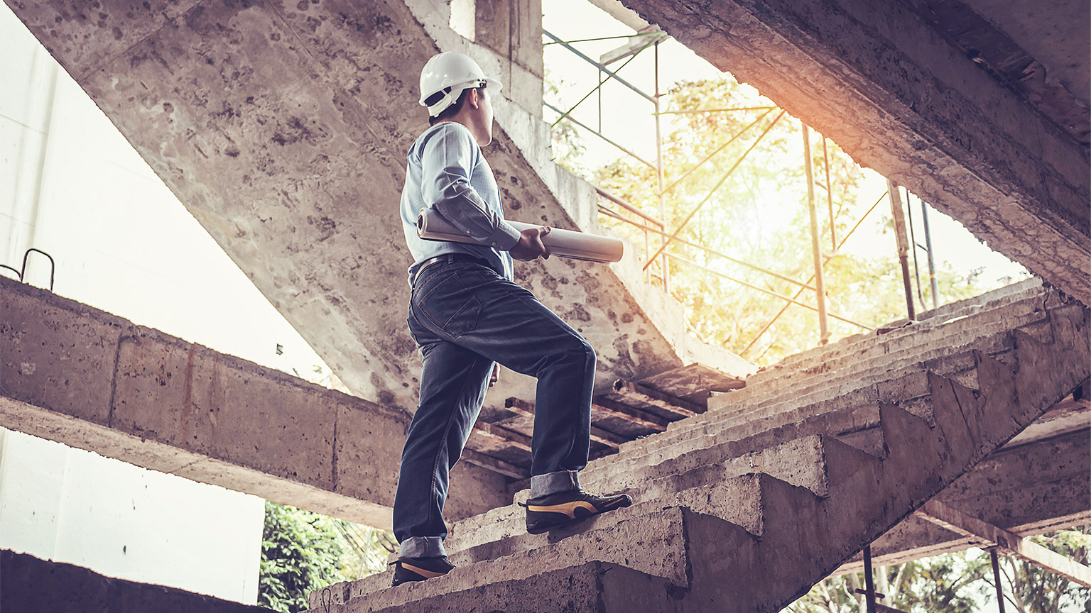 A construction worker preparing to conduct a condition report on site