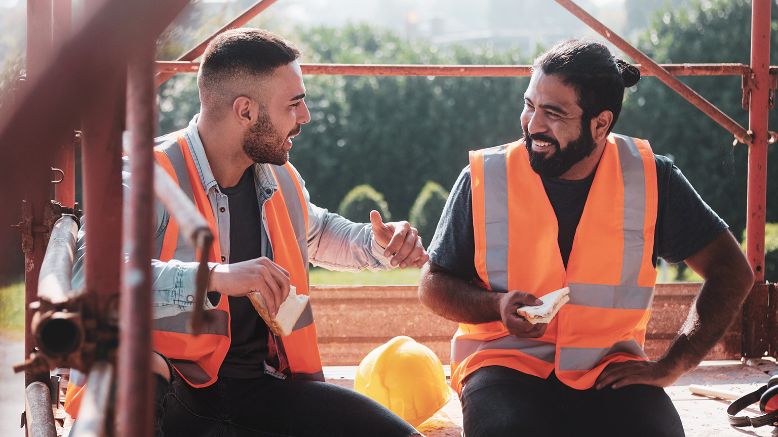 Two construction workers enjoying a break while on site