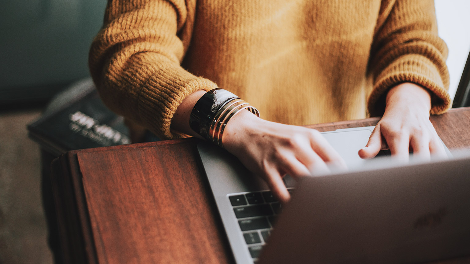 A close view of a student accessing reference materials on their laptop