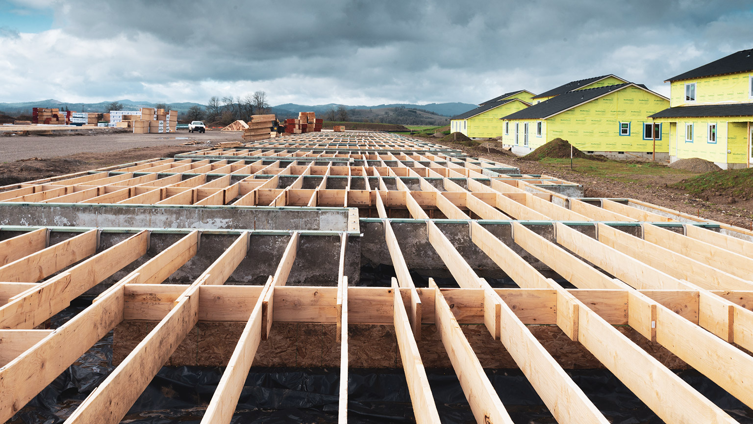 A low angle view of several new house construction sites