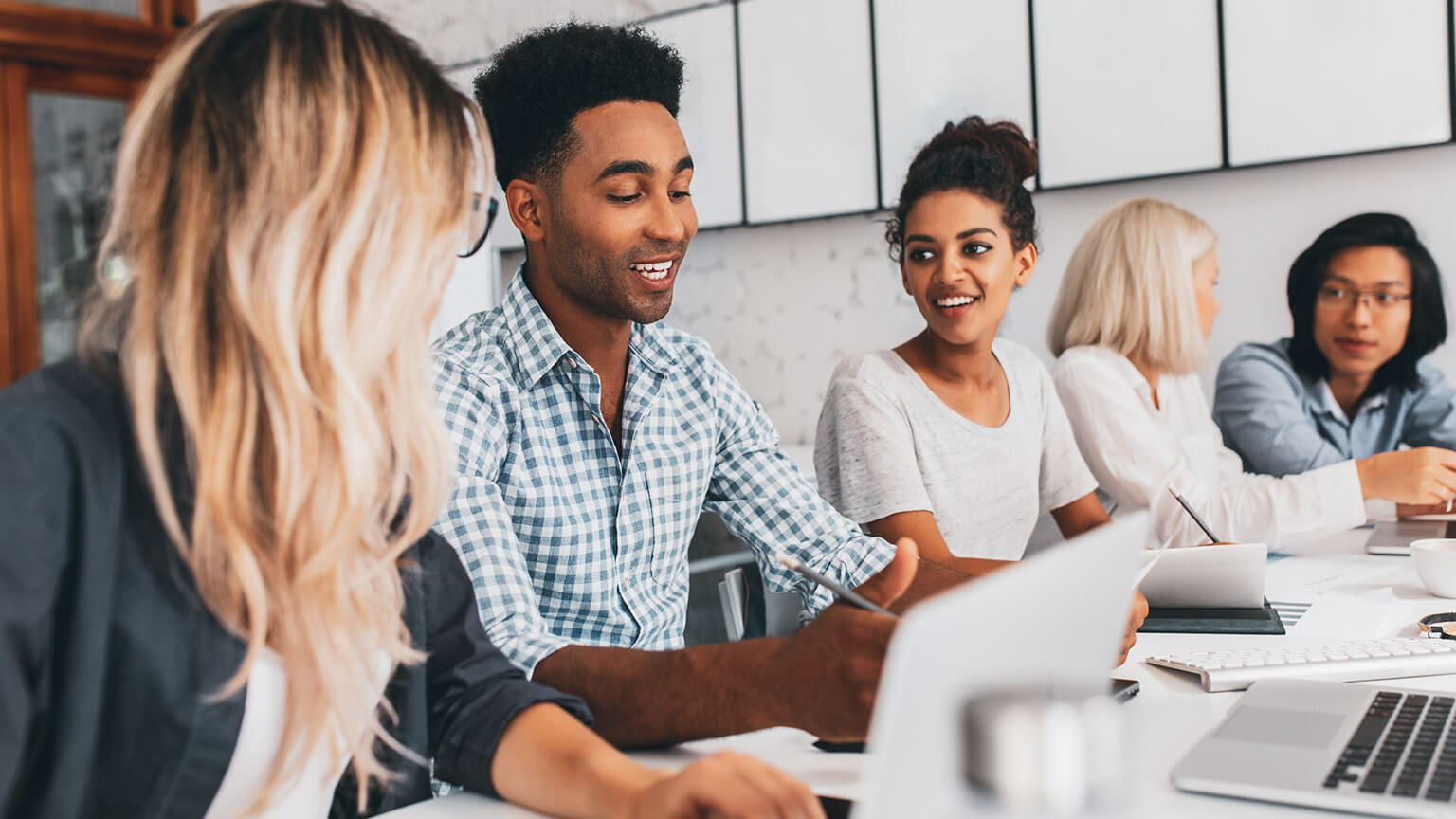 A group of young professionals working together at a table