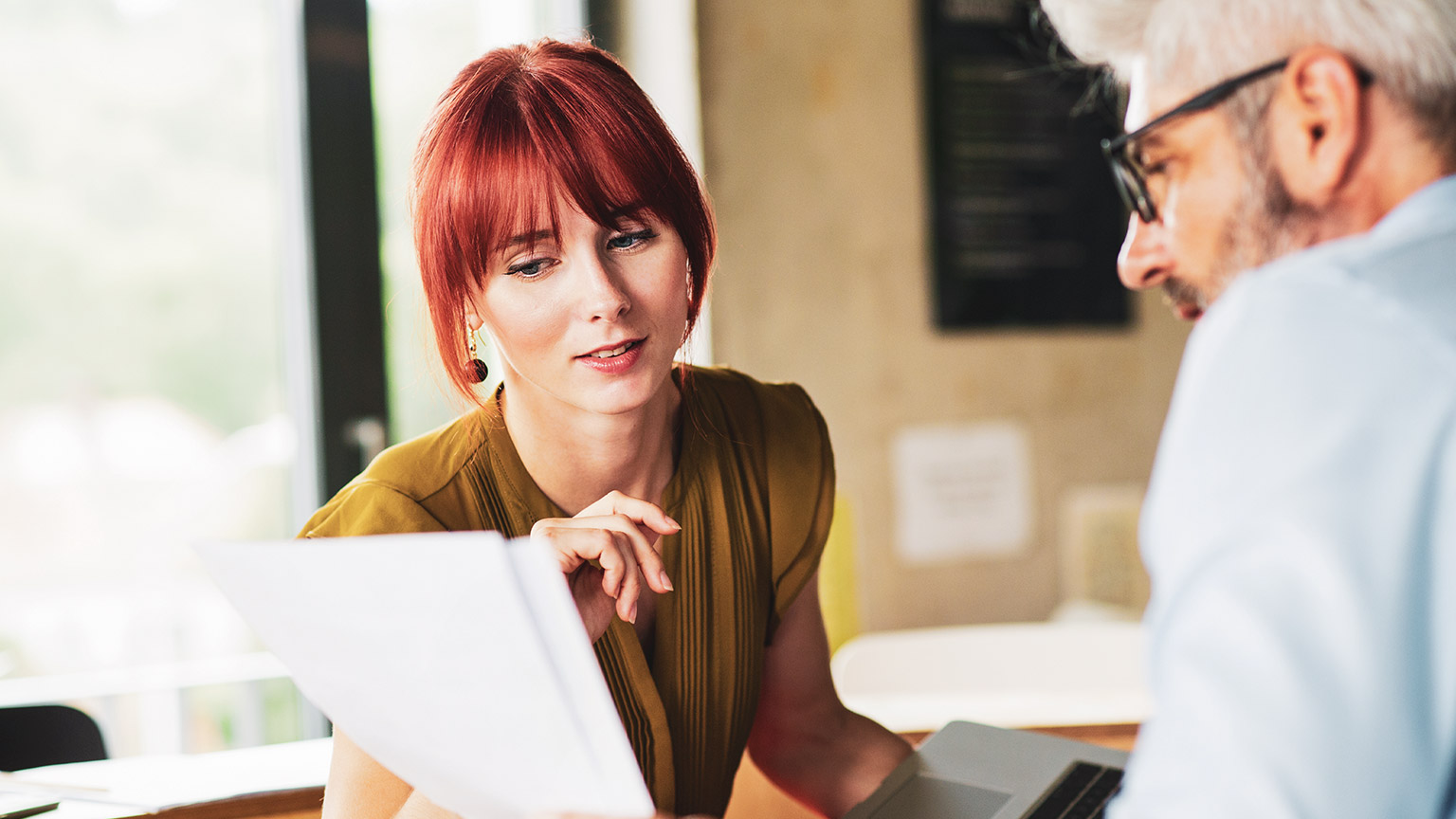 An accountant talking figures with a colleague