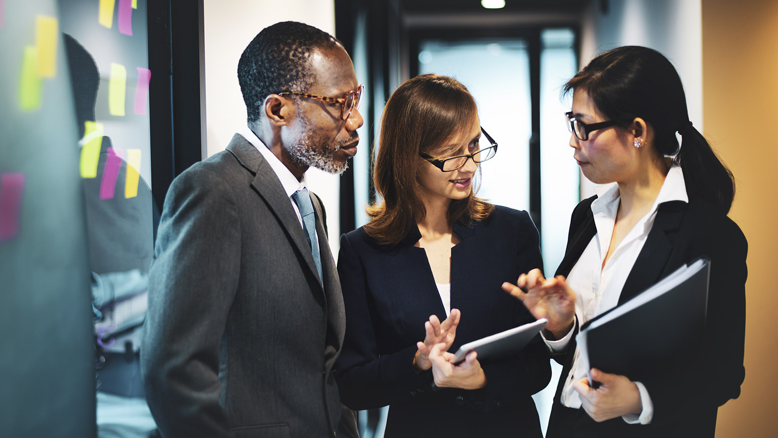 A group of business people of different nationalities discussing a project