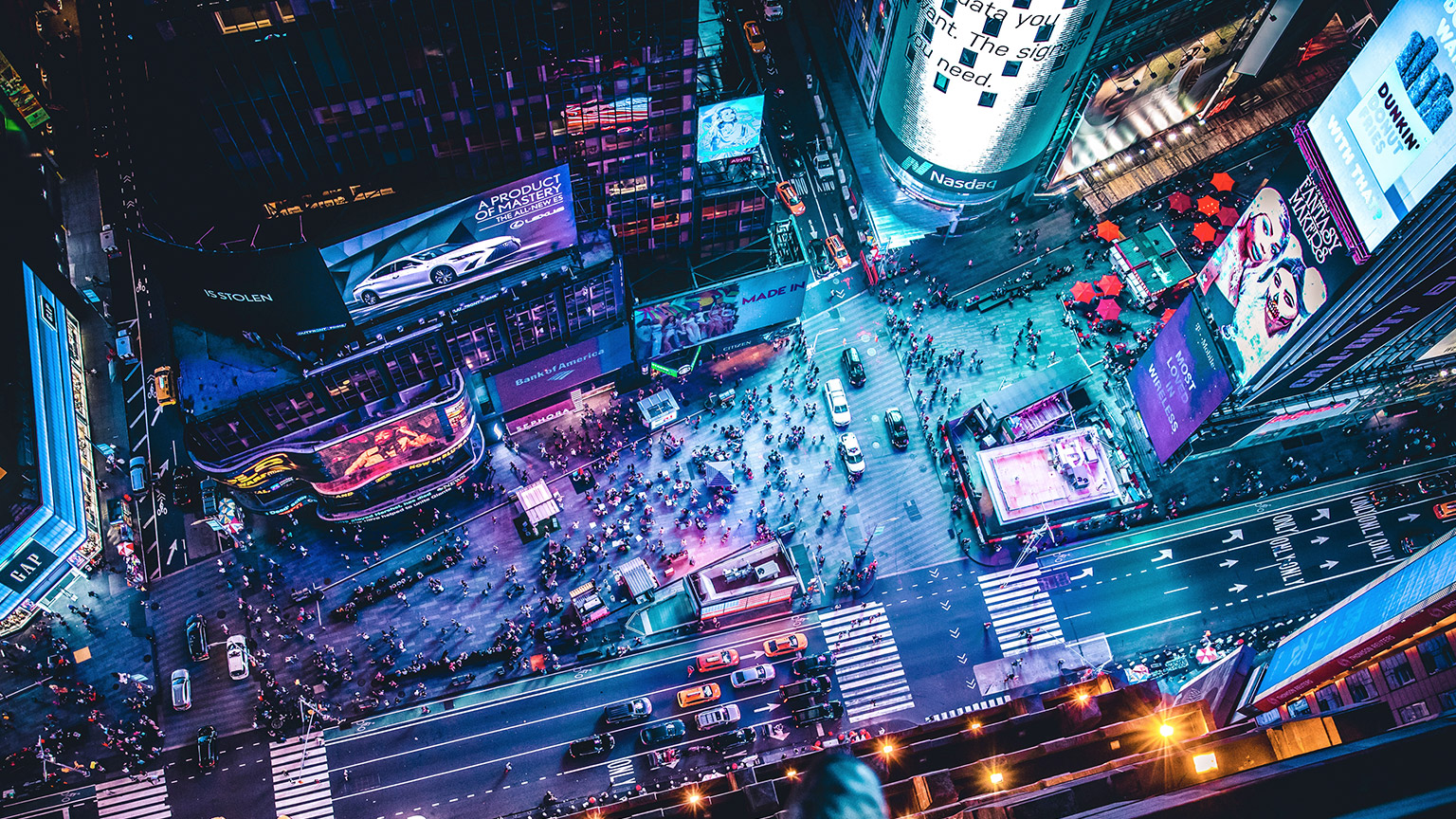 An aerial view looking down on the neon advertising of Times Square