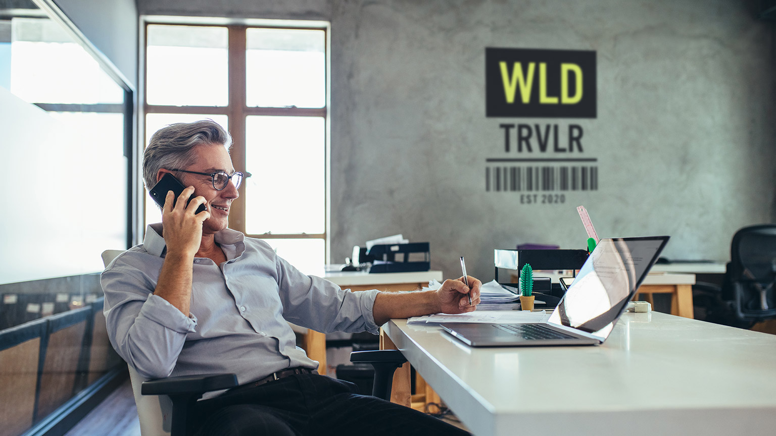 The owner of World Traveller travel agency making a call to a valued client