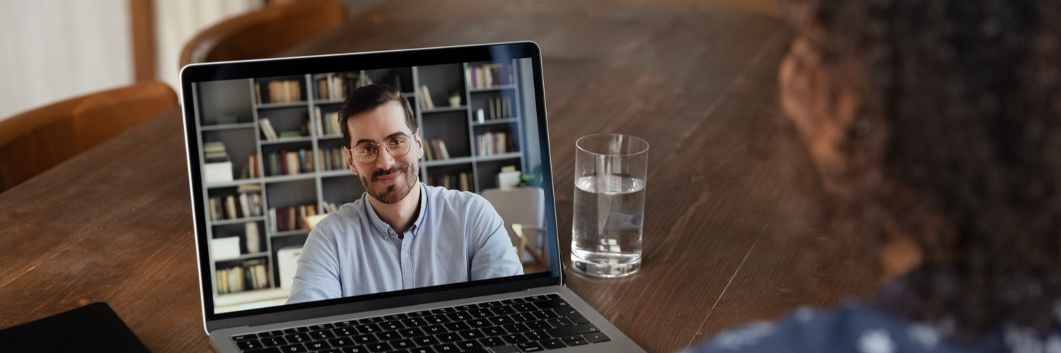 Computer showing lecturer on Zoom call