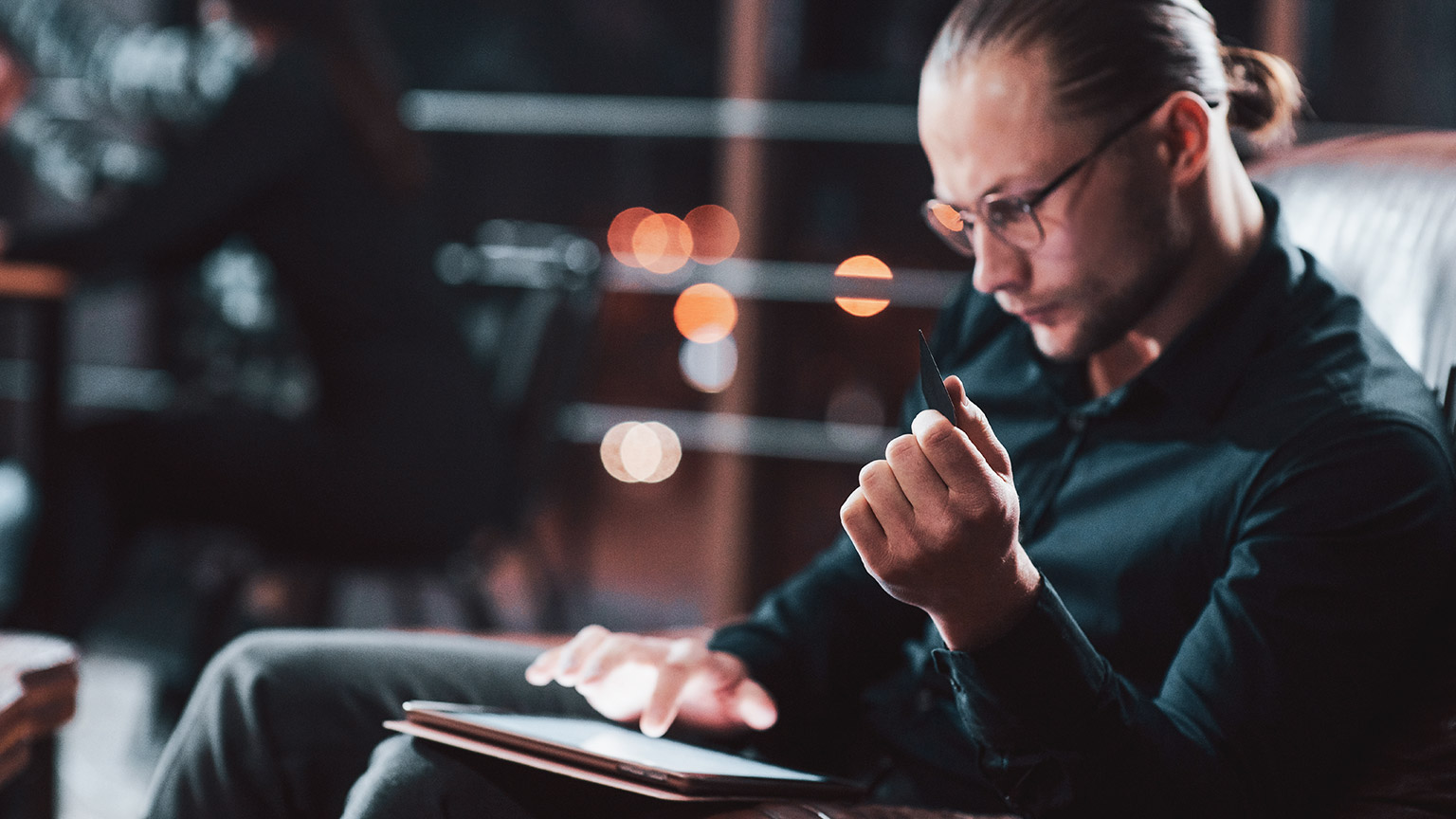 A hipster programmer testing site security on a tablet device