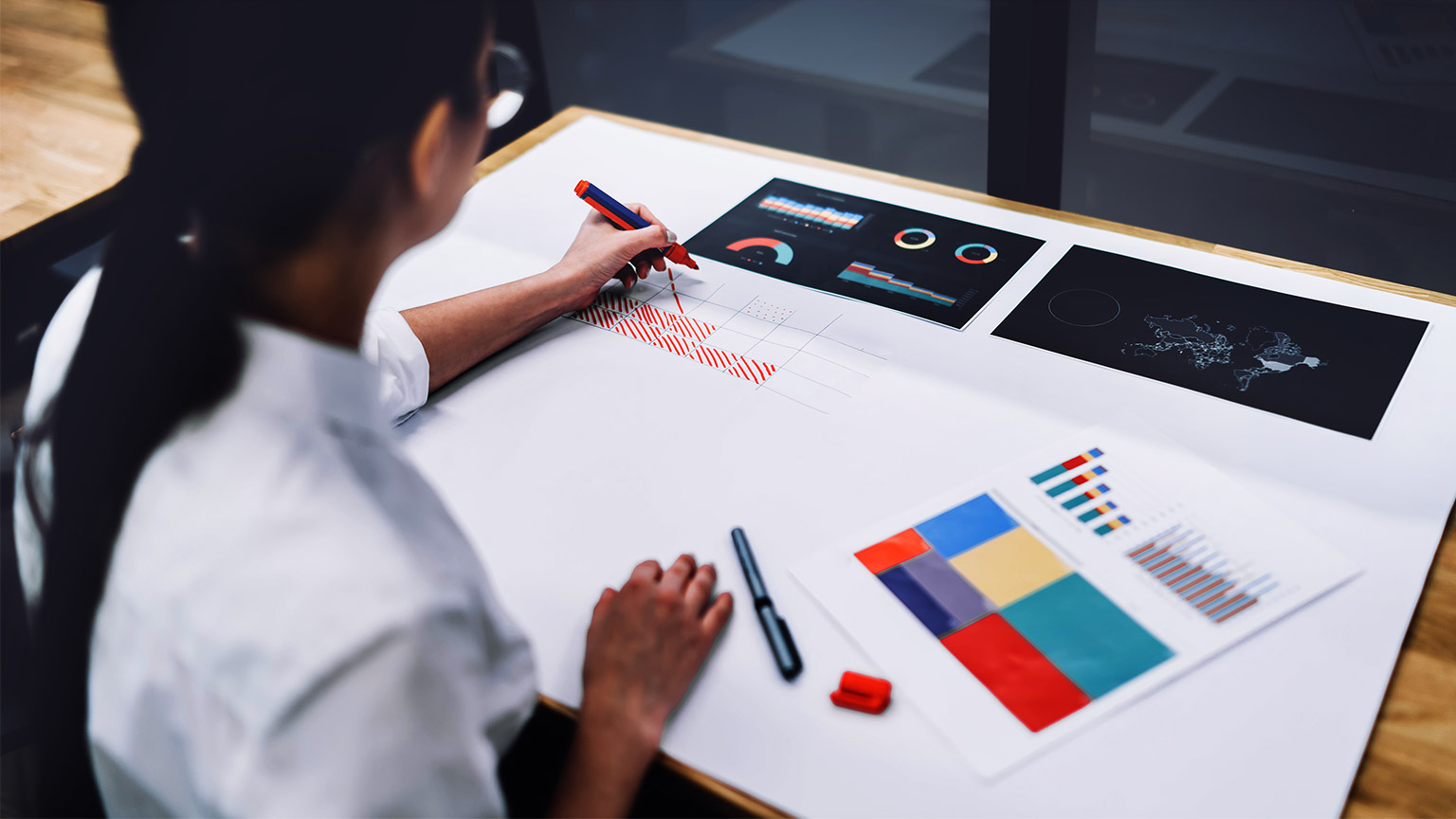 a person checking charts and diagrams on the table