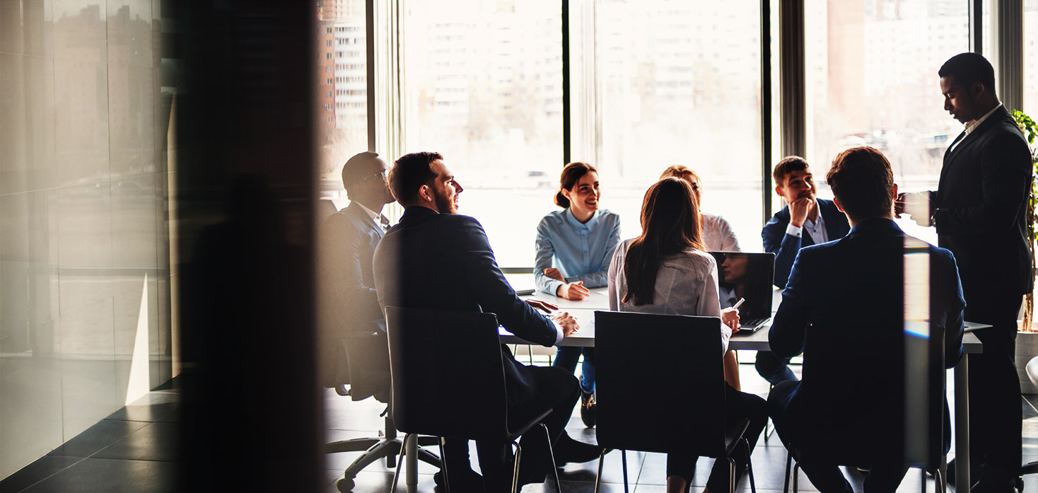 Business people strategizing about individual functions of their employees in a conference room