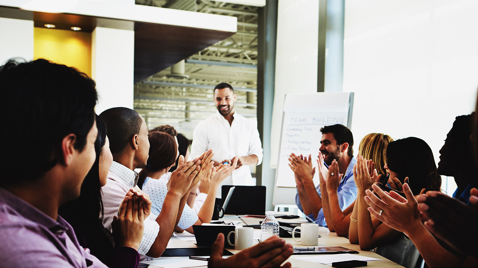 a busienss owner meeting with employees