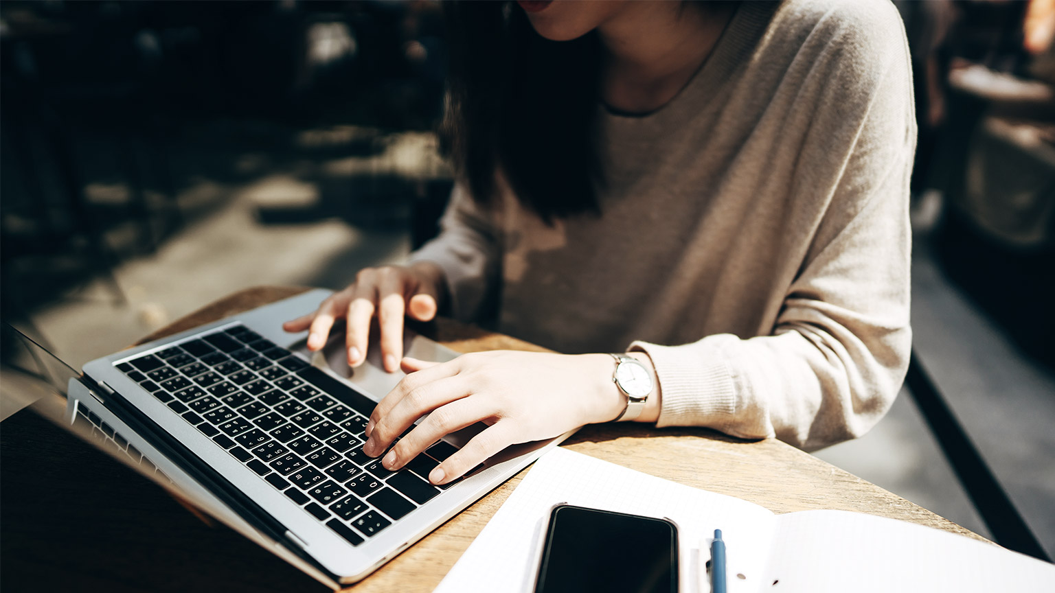 a person researching on a laptop