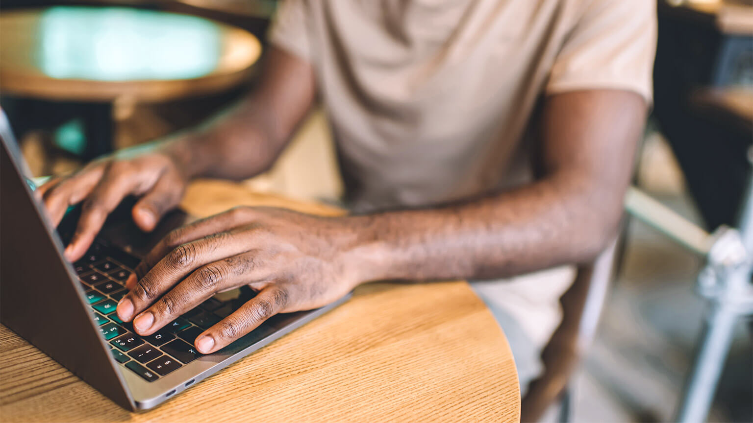 A developer seated in front of their laptop, working through one of their tickets for a sprint they're involved in