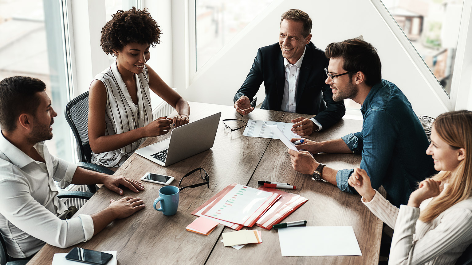 Happy employees being productive and positive