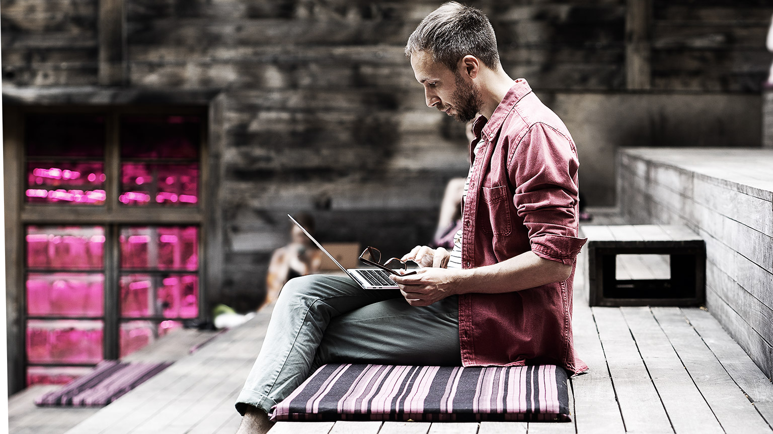 A person studying in a park near the workplace