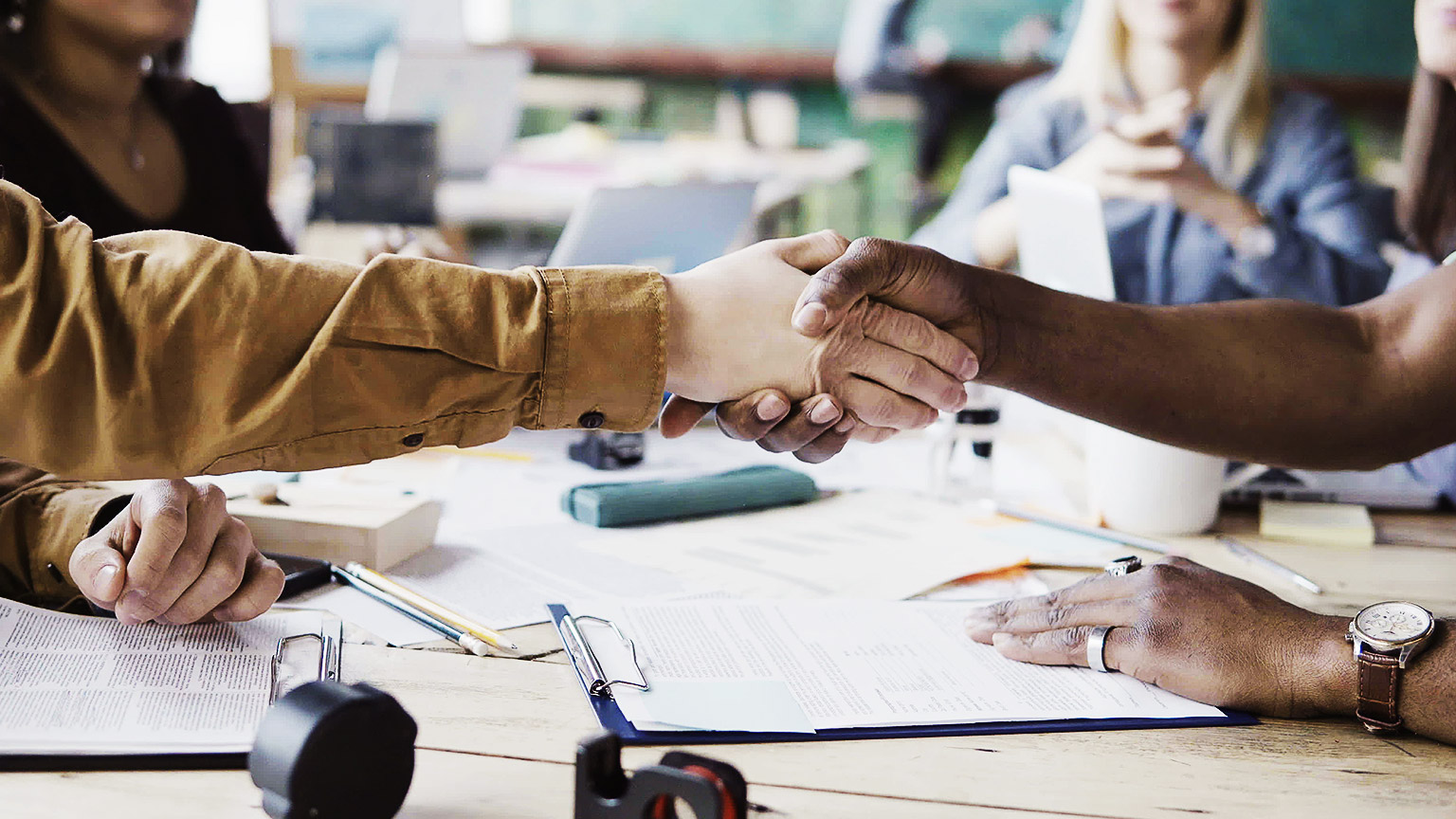 Business people shaking hands having a good deal