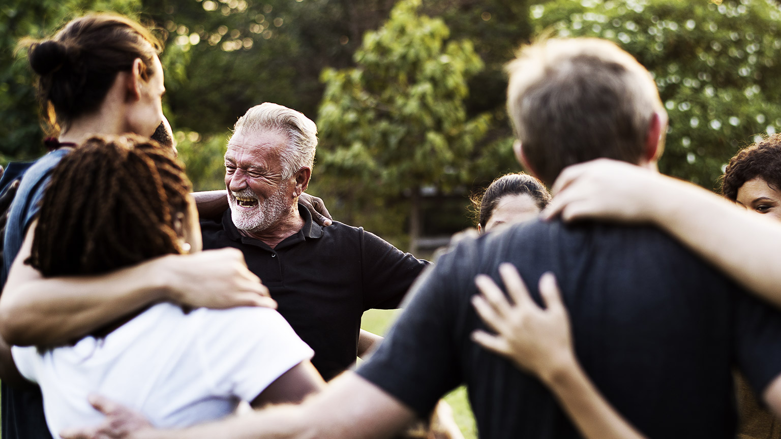 Group of Diverse People arm in arm in Volunteer Community Service