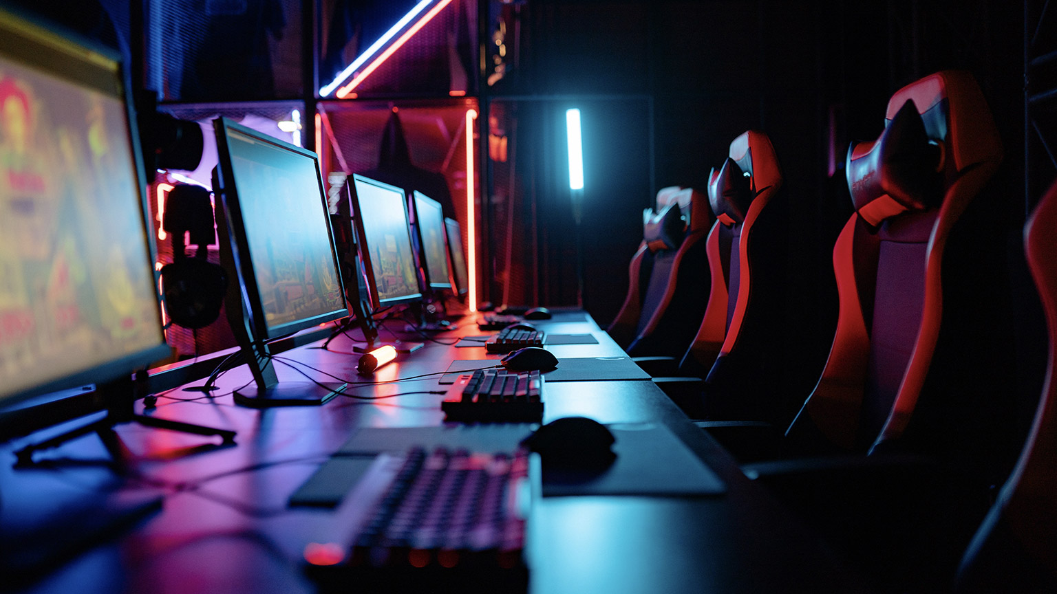 A wide shot of a row of gaming computers