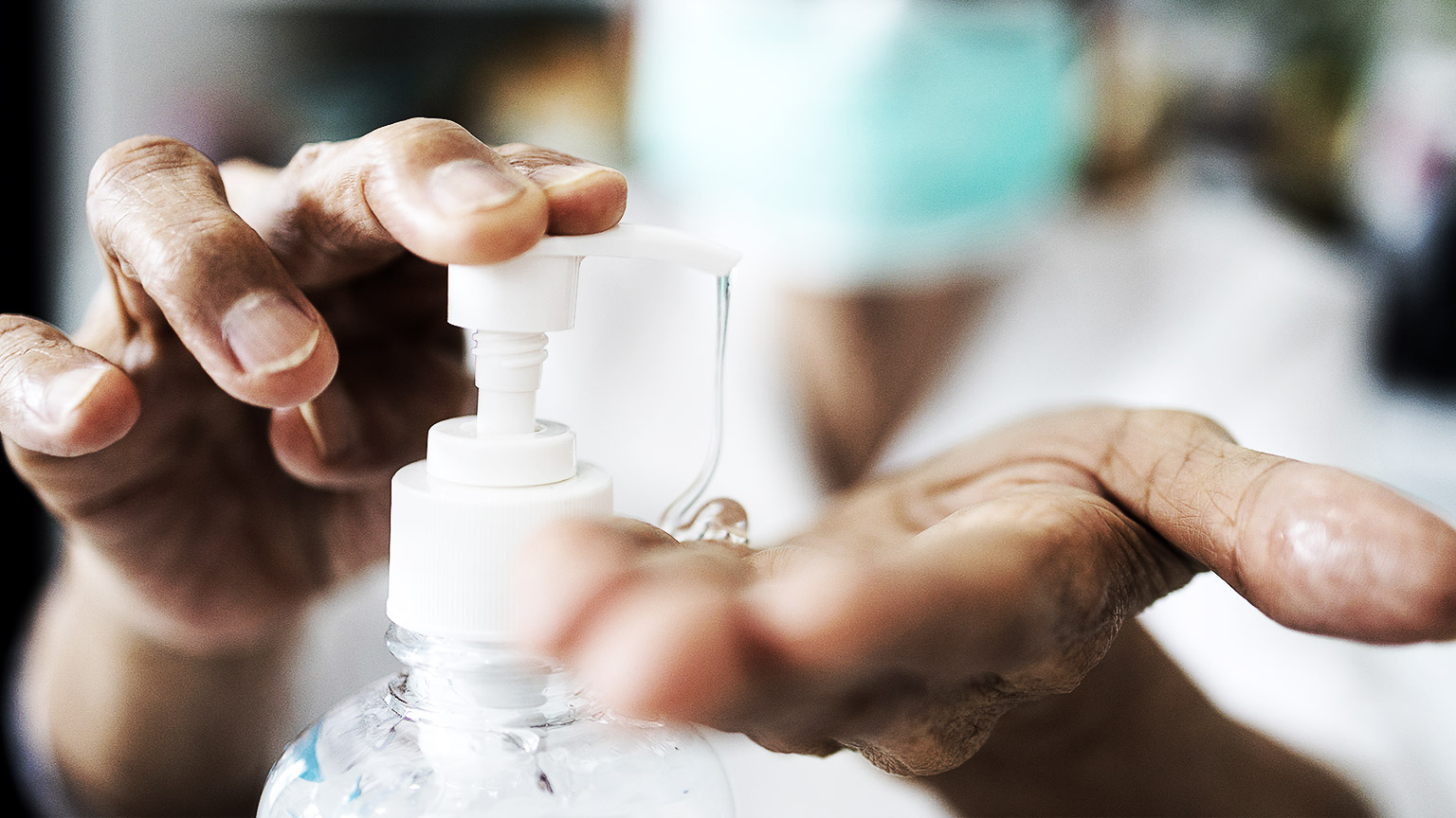 A person disinfecting their hands