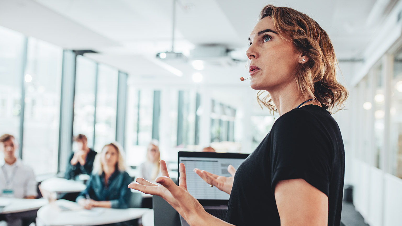 A professional making a presentation to colleagues in an office