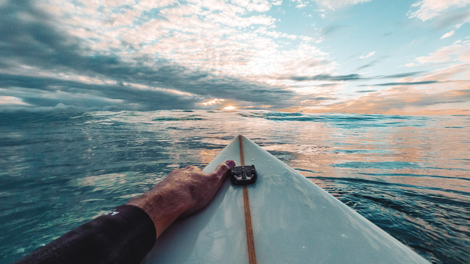 The perspective of a surfer heading out for an early morning session