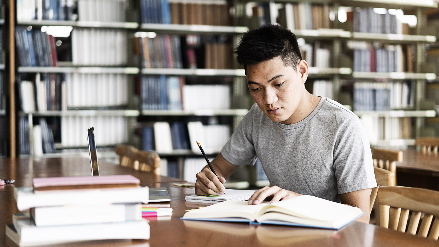 A person researching in a library