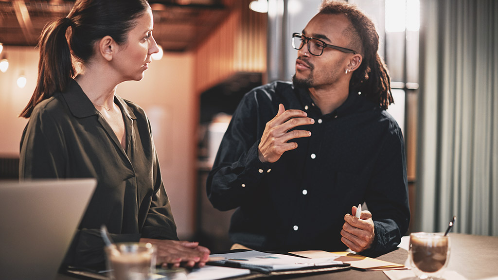 Two people discussing a private matter