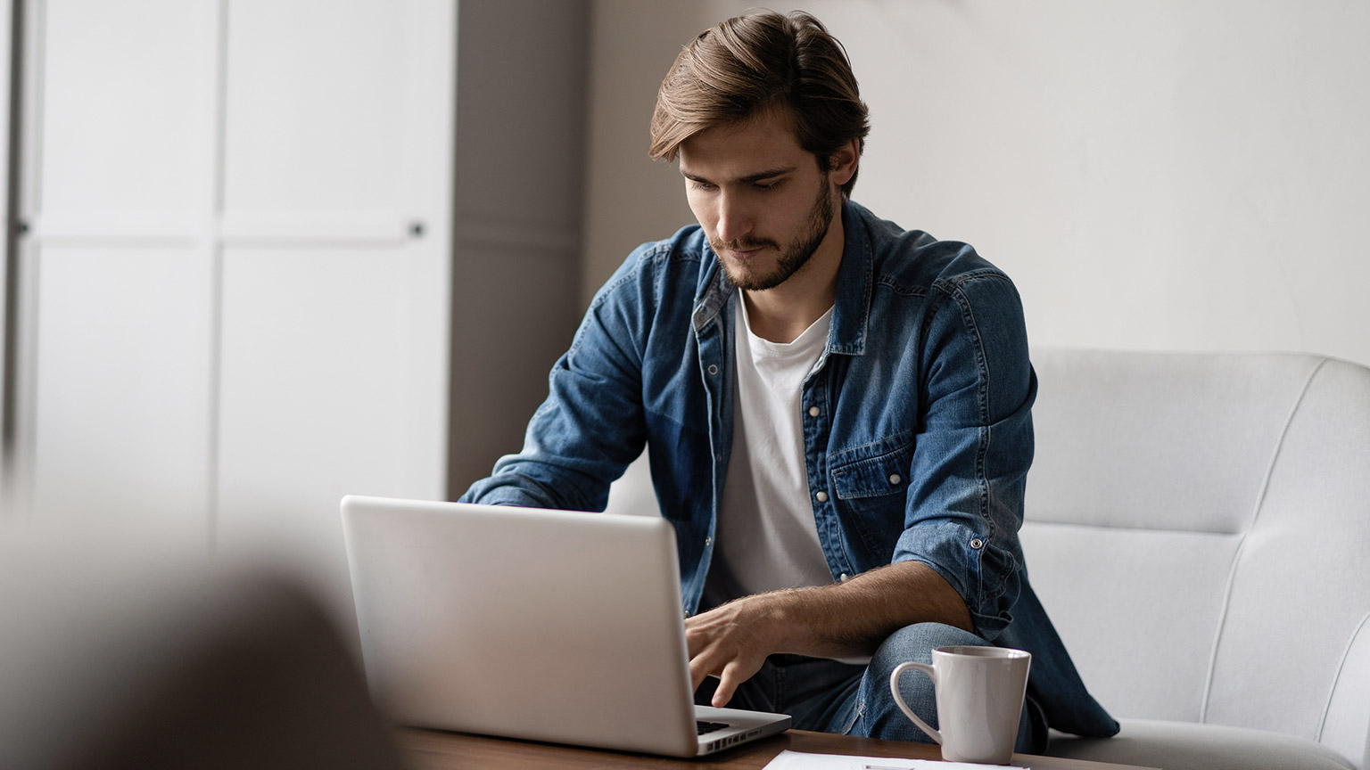 young man working on laptop