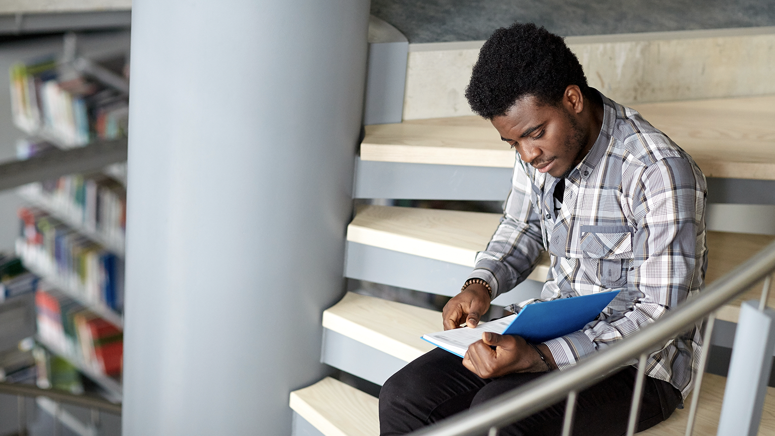 young man sitting at stair