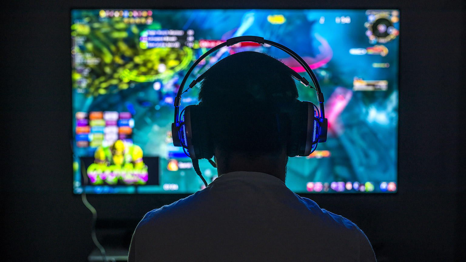 Over-the-shoulder image of a gamer playing a game