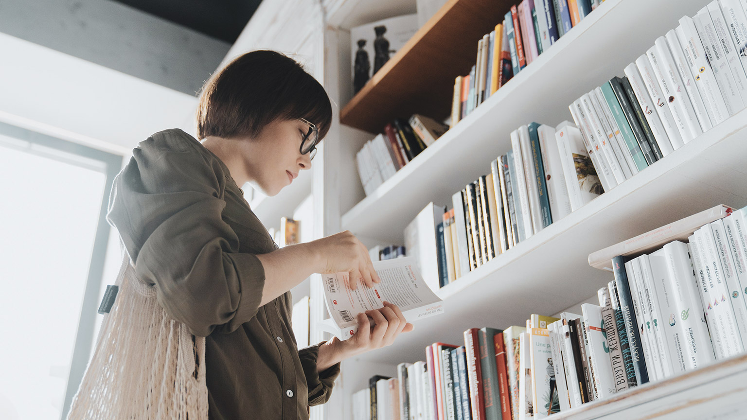 A person reading reference materials