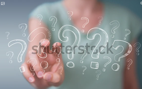 A hand reaching out with question marks, asking questions