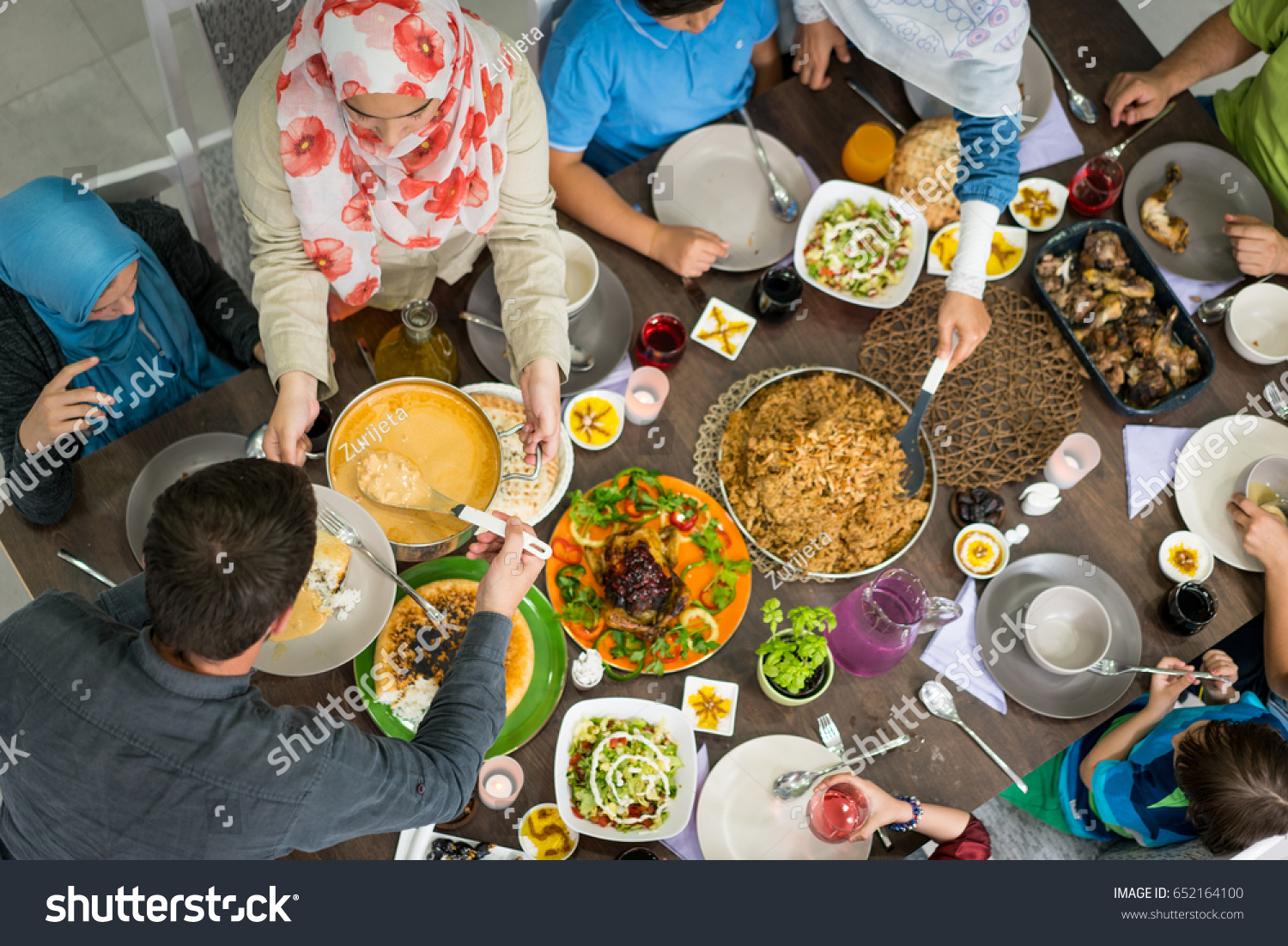 Top view of family and friends eating food on table