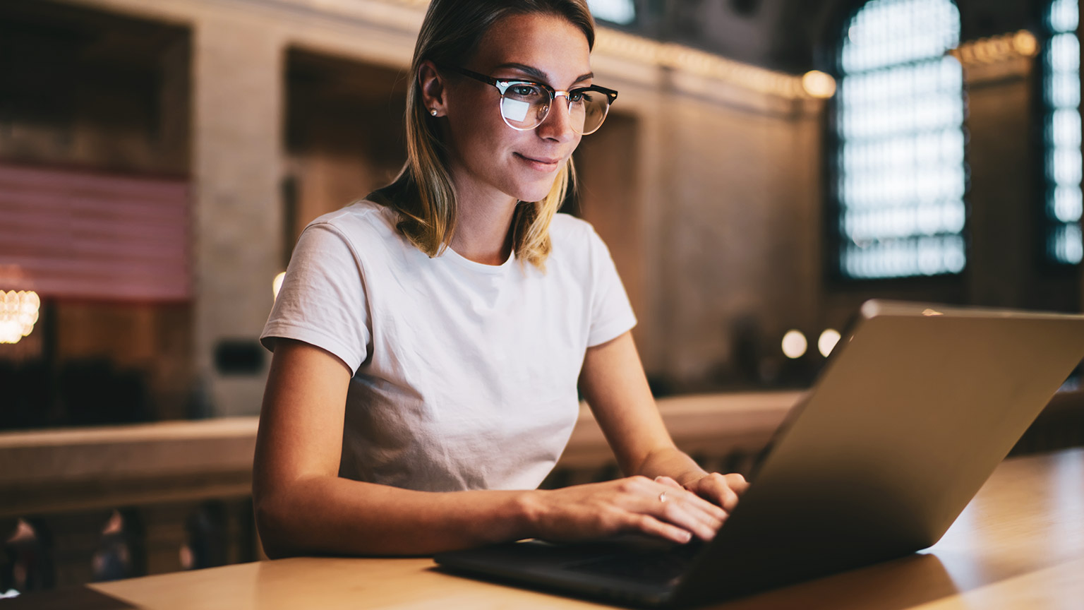 A student accessing reference materials in a library