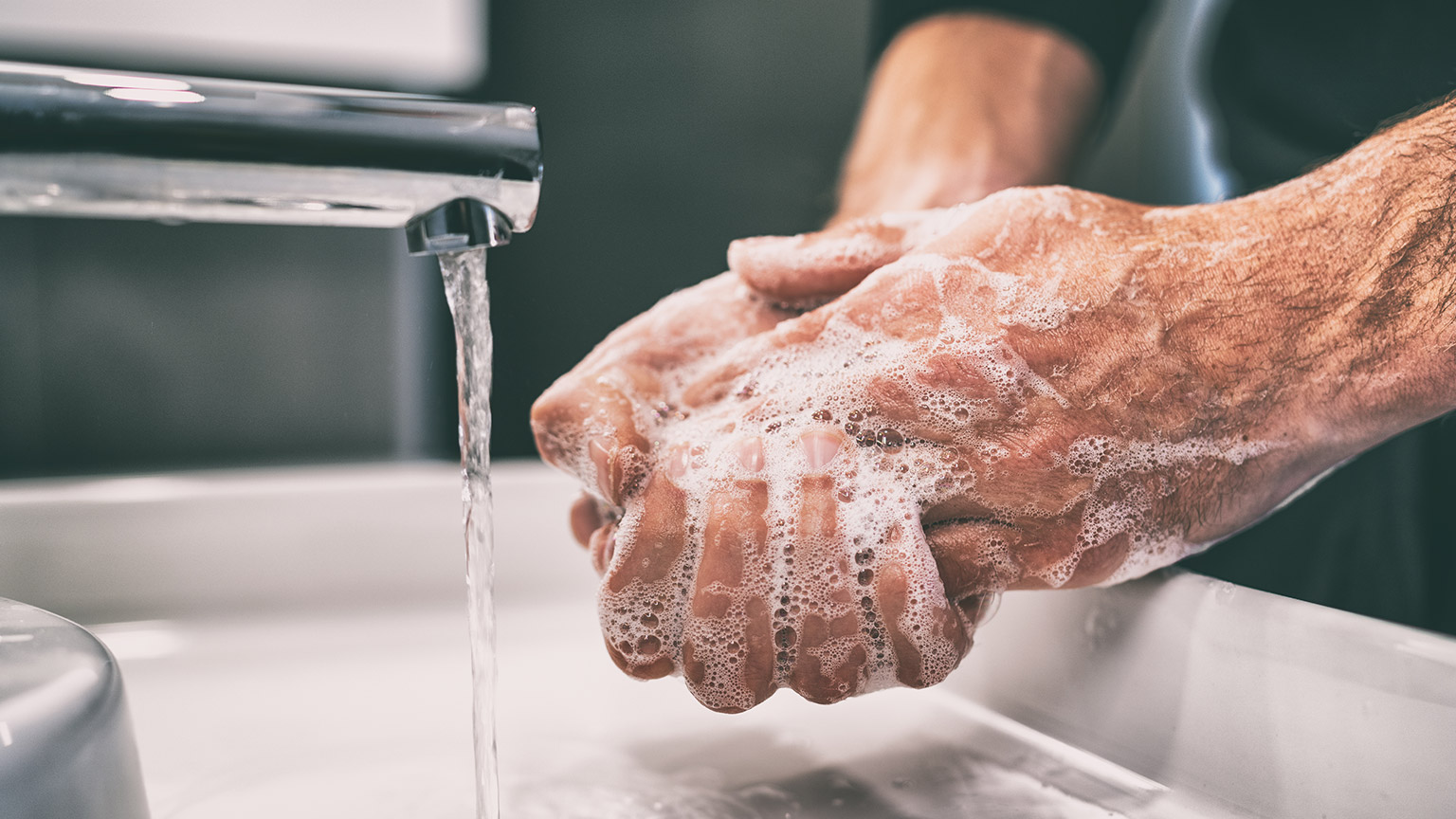 A close view of a person washing their hands