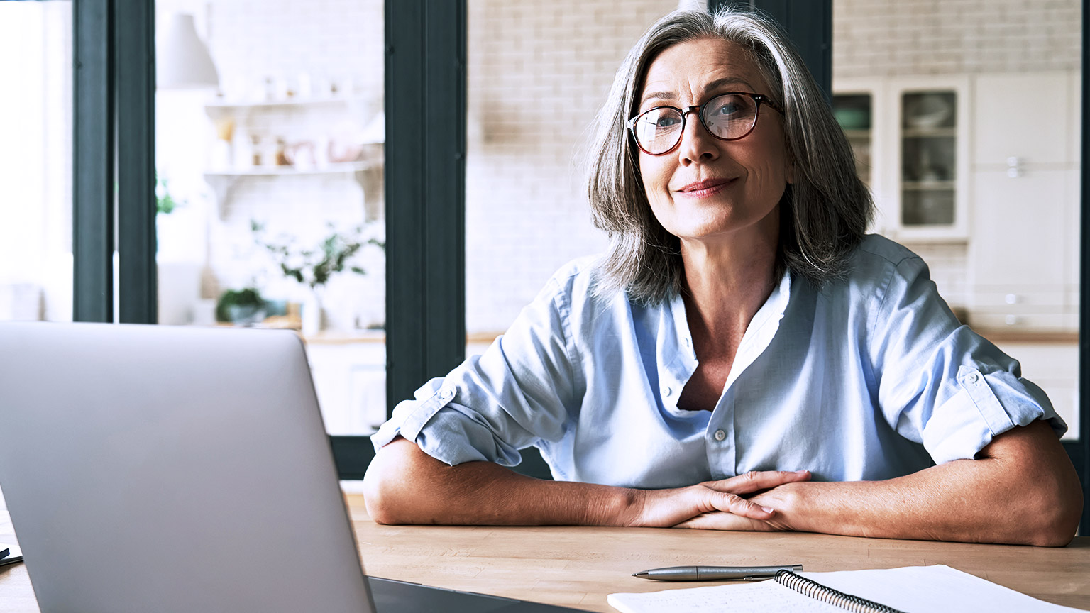 matured woman infront of computer