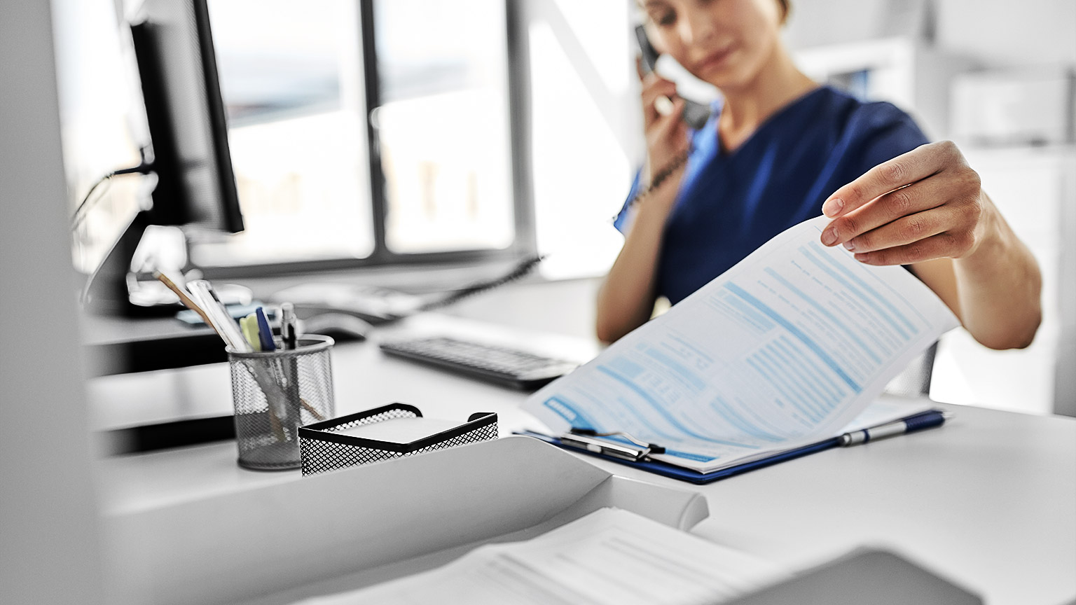 A receptionist booking an appointment