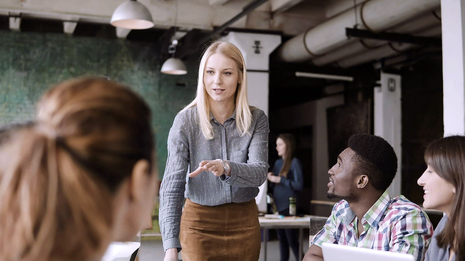 Woman giving direction to a team