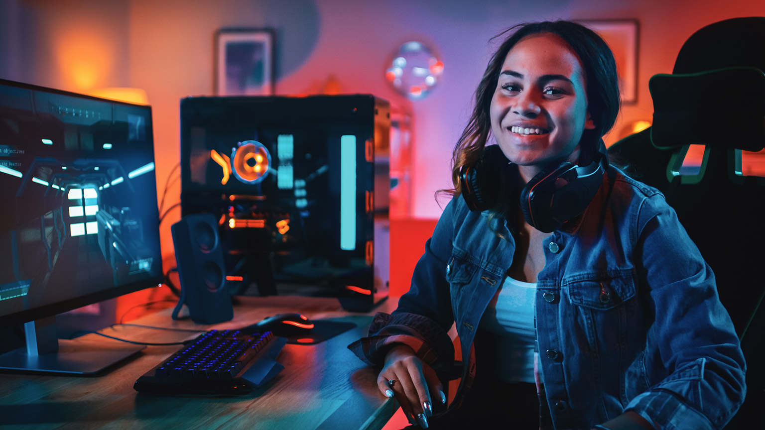 A young gamer smiling at the camera in an online gaming setting