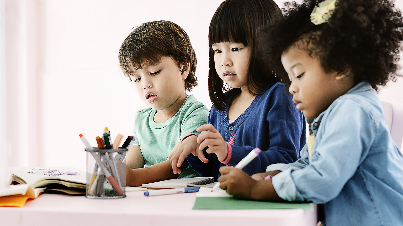 Toddlers playing with toys intently