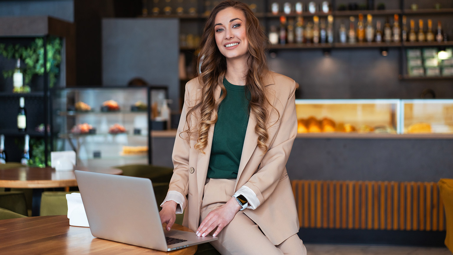 A business owner sitting in her restaurant