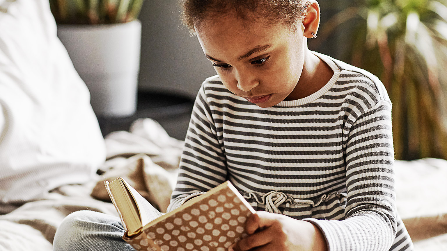 A young child reading abook