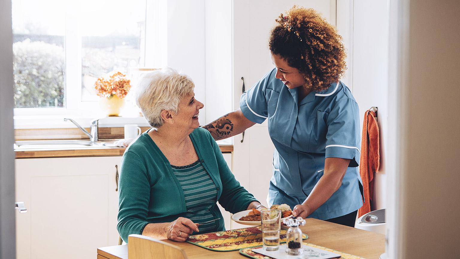 A carer and client having a casual conversation