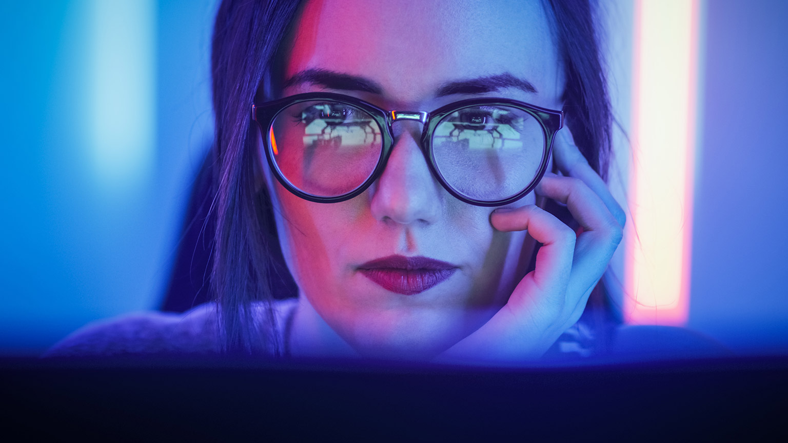 A close shot of a designer looking at a computer screen