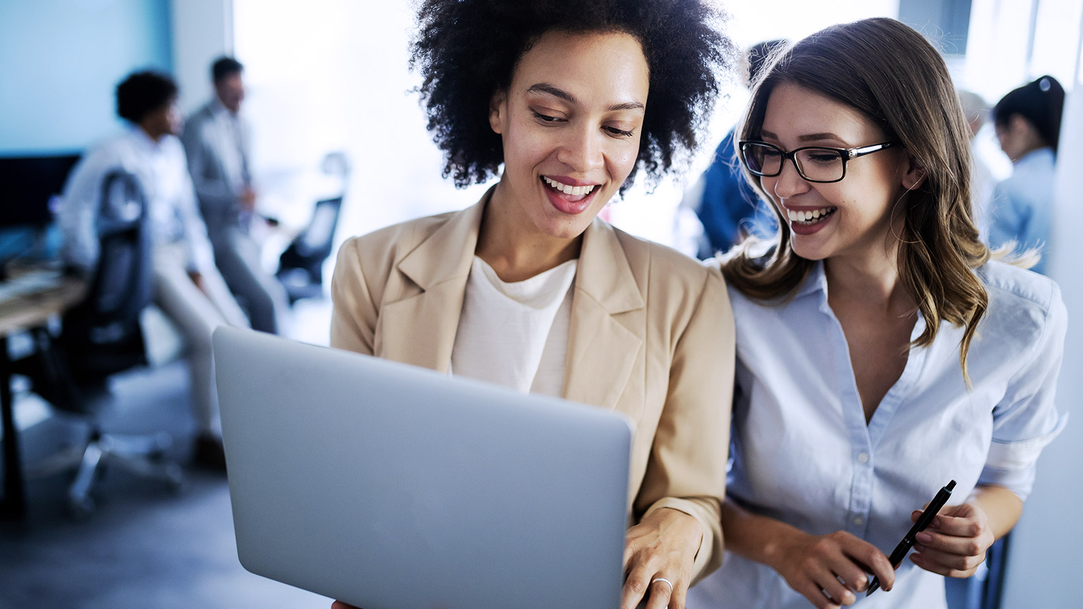 Office workers laughing together